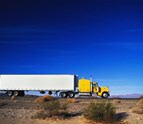 Blue_Water_Trucking_Side_View_Of_Semi_Truck_on_the_road.jpg