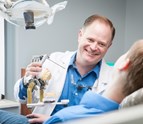 Spokane_Prosthodontist_Dr_Molgard_sharing_lighter_moments_with_patient.jpg